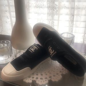 A Copy Chanel black espadrille.